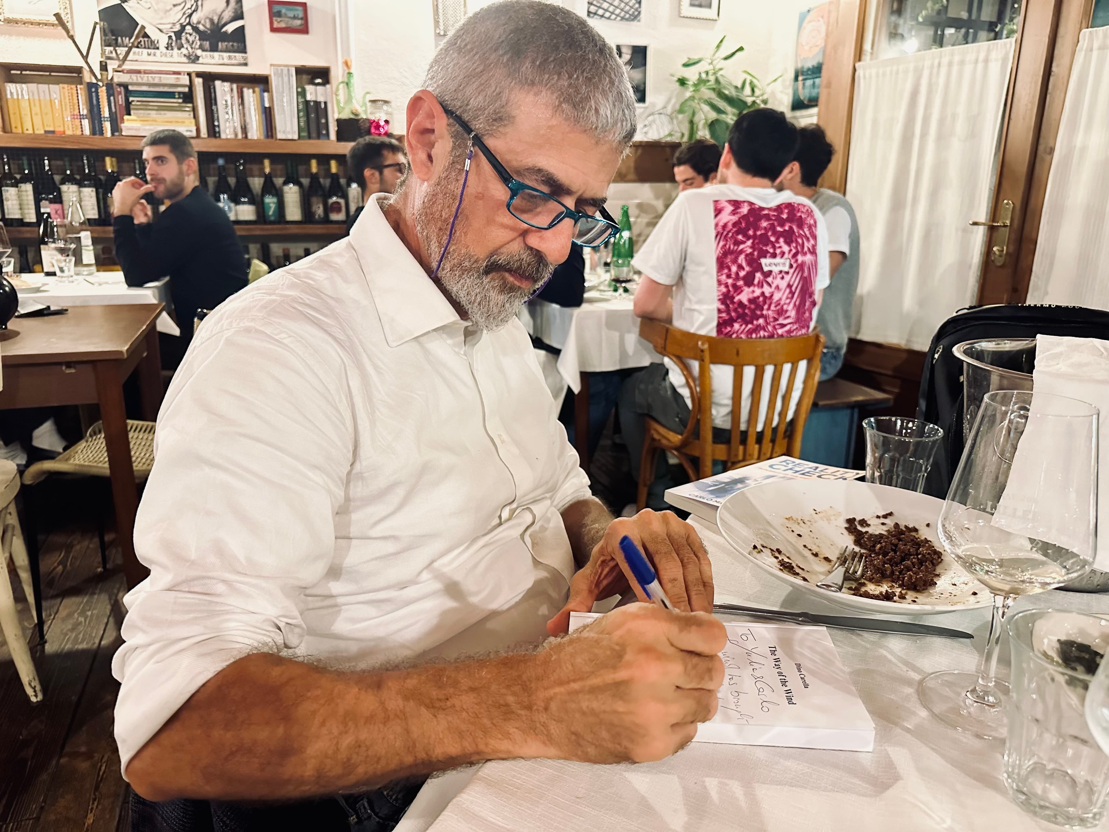 Auhto of the Way of the Wind, Dino Carella, signing his book to Carlo Mahfouz.